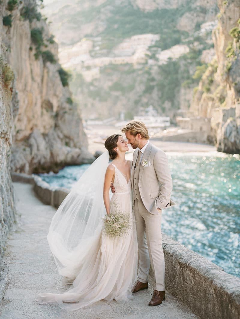Bride and groom on the Amalfi Coast at golden hour, destination wedding by Michigan Luxury Weddings